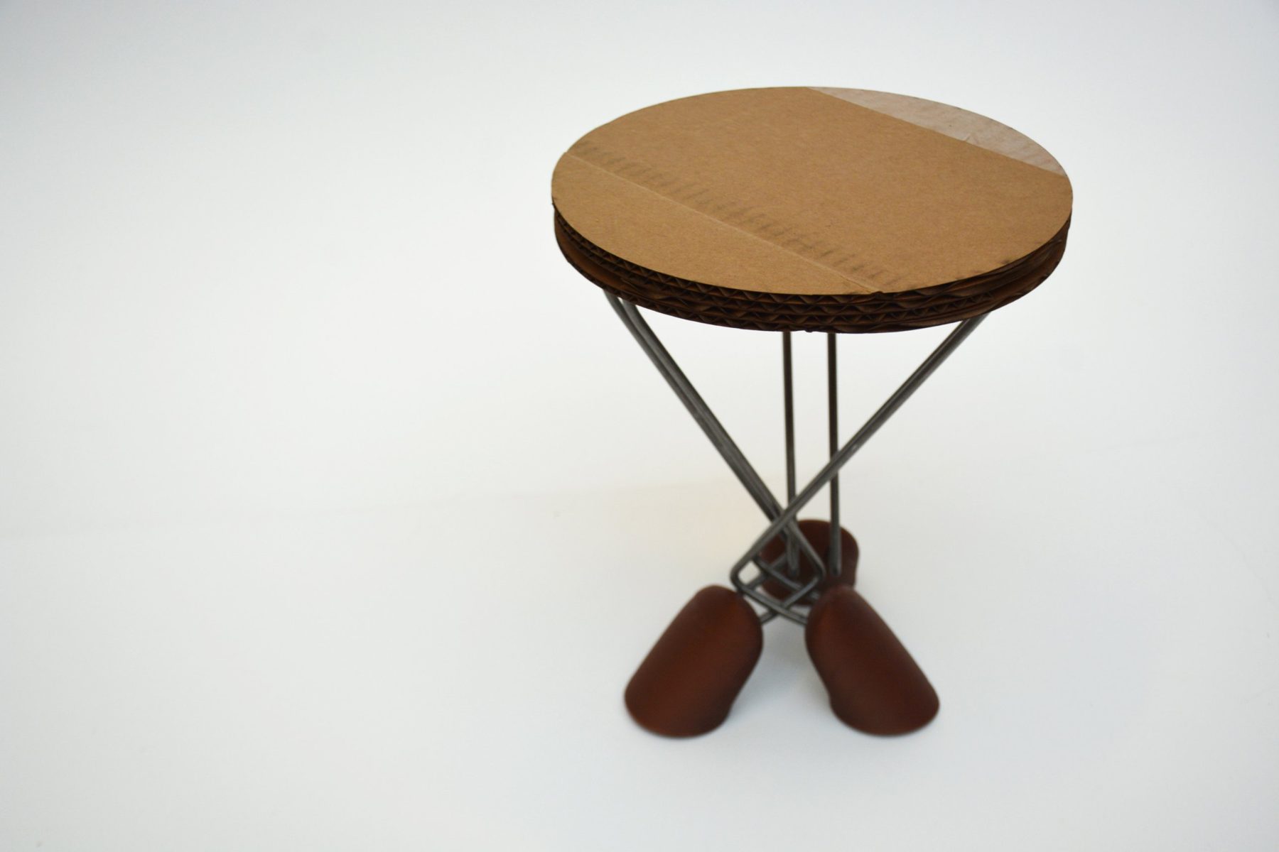 Wire frame stool with cardboard seat and cast feet