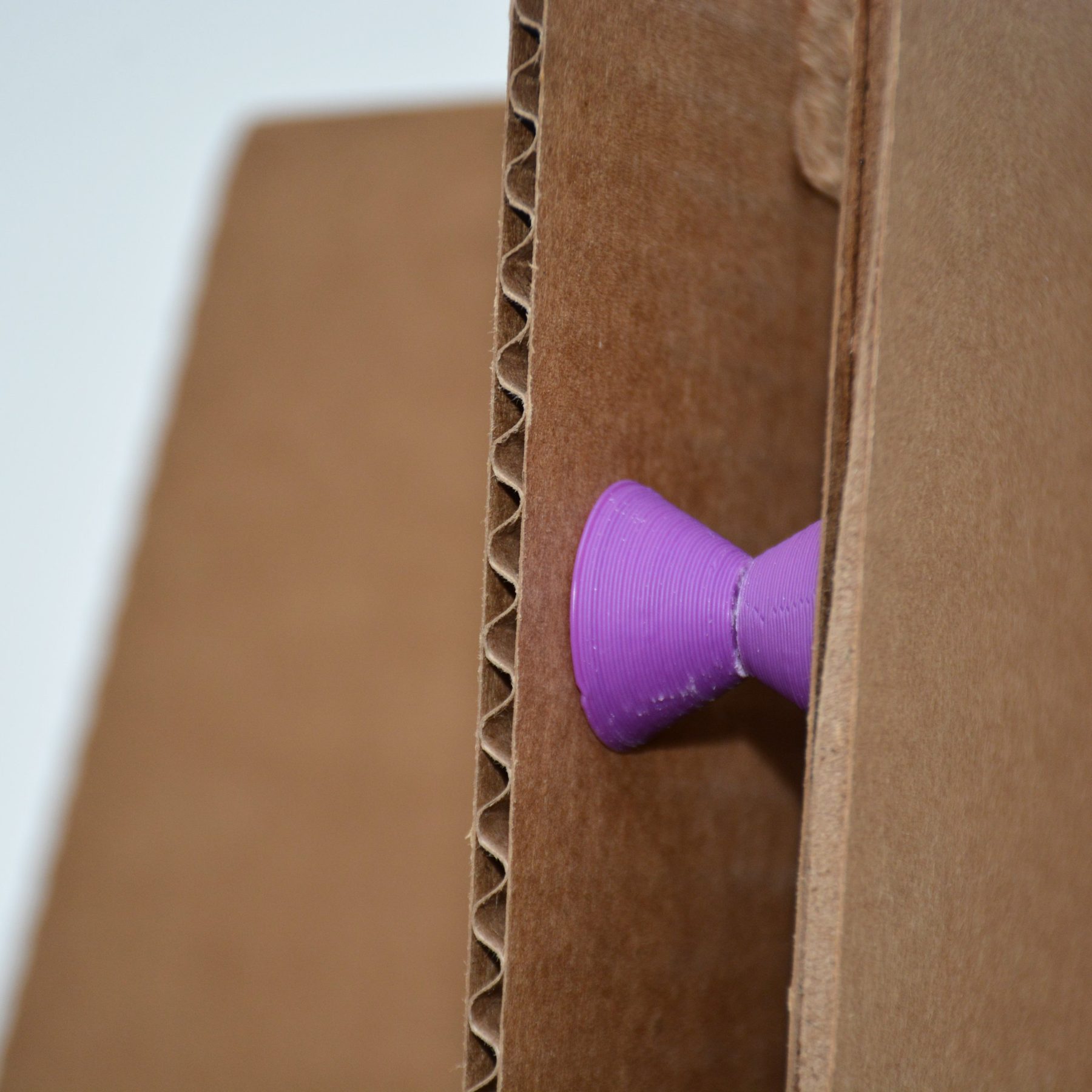 Printed spacer holding two cardboard panels apart